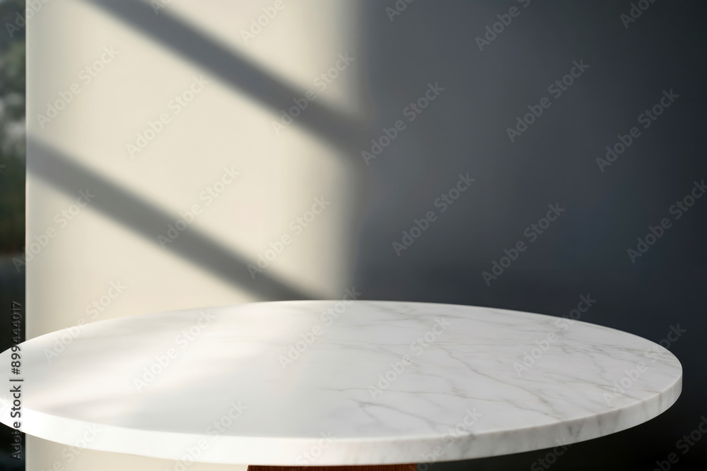 Poster Empty round marble table top with gray and white wall background with window light, perfect for product placement