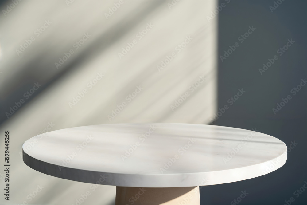 Poster Empty round white table top for product placement with sunlight shadow background