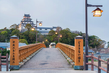 Jyounai bridge with light bulb lamp and Karatsu castle at sunset