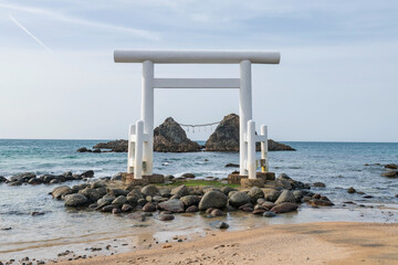 torii gate and couple stones over sea, Itoshima Sakurai Futamigaura