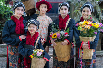 Portrait fashion of younger cute Hmong or Yao Hill Tribes teenagers in beautiful traditional dress...