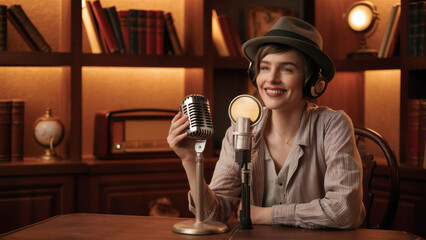 A woman sitting at a table with an old fashioned microphone, AI