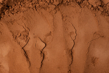 Abstract brown background of spilled cocoa powder