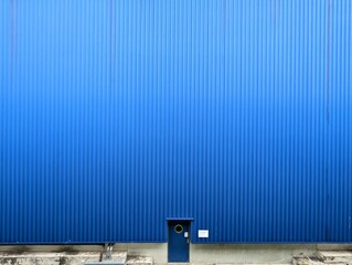 Blue door on blue background wall