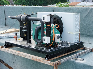 Industrial cooling unit installed on a building rooftop, ready for operation