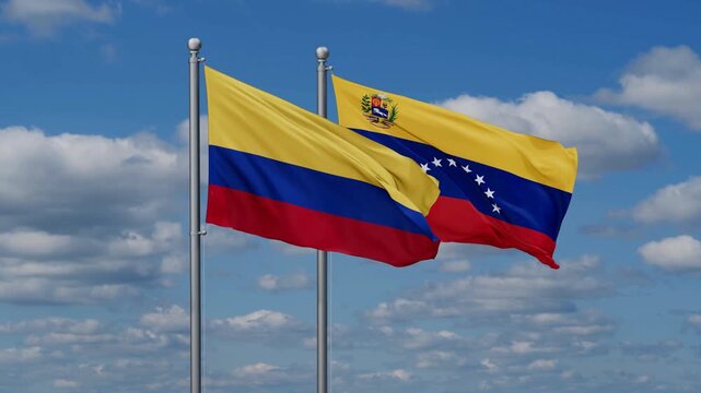 Venezuela and Colombia flags flying together, video concept of the relationship
