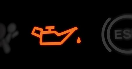 Low oil pressure warning light of car dashboard, oil funnel icon indicator, close-up, footage