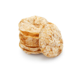 Stack of round brown rice chips, salty crispy snack isolated on white background    