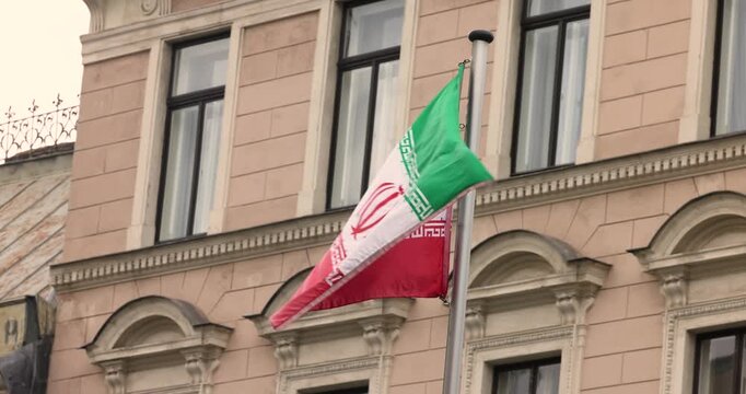 The Iran national flag waving. The Islamic Republic of Iran is a State of Asia located on the Middle East. Slow motion 