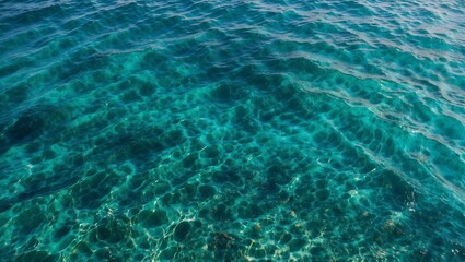 Obraz premium Clear turquoise waters showcasing seabed from above.