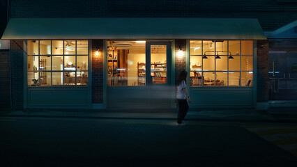 Warm lights of an old cafe, night, passers-by