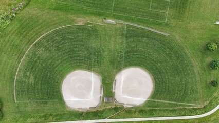 Aerial view of two adjacent baseball fields with green grass and dirt infield in Waterloo, Canada