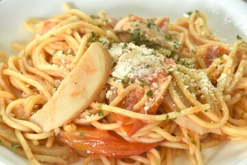 fried spaghetti Napolitan slice pork sausage with tomato topping parmesa cheese japanese food on plate