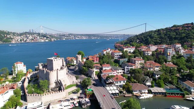 Fatih Sultan Mehmet Bridge and Anadolu Hisari (Anatolian Fortress) in Istanbul, Turkey. Beautiful Istanbul bosphorus landscape. Drone shot.