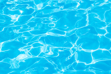 blue water surface background with ripples and sunray pool summer