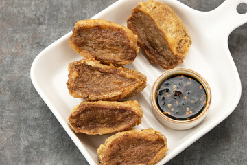 Tahu Walik, fried tofu stuffed with meatball. Indonesian food
