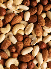mix of nuts from almonds, walnuts, cashew and peanuts. close view