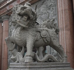 Traditional gate guardian dragon outside a Chinese temple