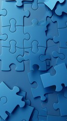 Close-up of blue puzzle pieces interlocking against a blue background. Represents the process of problem-solving, connection, and creativity.