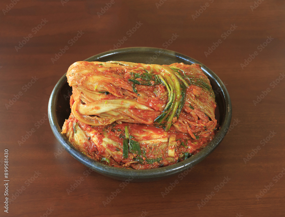 Canvas Prints Close-up of napa cabbage kimchi after Gimjang(kimchi-making) on a jar and red wood floor, South Korea
