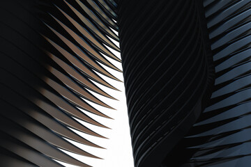 Naklejka premium Futuristic feather wings made of volcanic glass obsidian on white background. 3d rendering illustration.