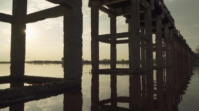 U Bein Bridge with lake, Wooden Bridge in Mon village, Myanmar or Burma, Asia.