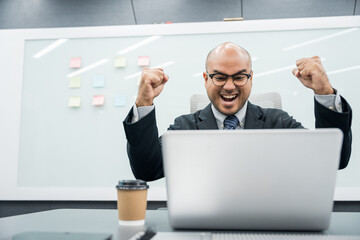 Young asian businessman working with laptop in the office. CEO Businessman analyzing statistics financial Meeting Conference Discussion various topic Corporate