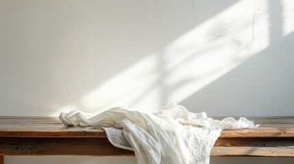 White wooden table with cloth and space for text