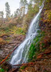 waterfall in autumn forest