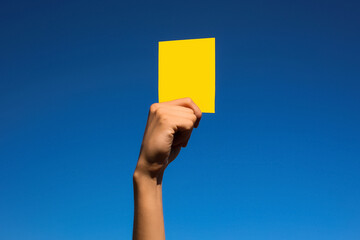 A yellow card. Warning. The game is on the verge of a foul