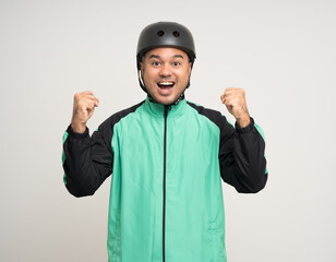 Young asian rider wearing green jacket uniform and bike helmet standing various action on isolated white background. Male delivery service worker. Delivery courier and shipping food service.