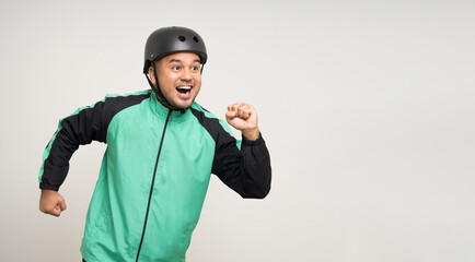 Young asian rider wearing green jacket uniform and bike helmet standing various action on isolated white background. Male delivery service worker. Delivery courier and shipping food service.