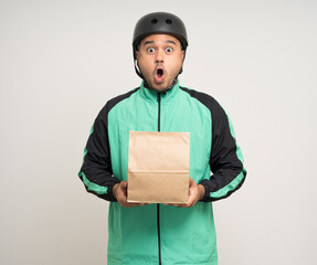 Young asian rider wearing green jacket uniform and bike helmet various action holding food paper bag delivery to customer. Male delivery service worker. Courier and shipping food service.