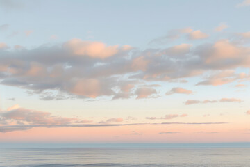 Serene Sunrise Sky with Pastel Colors and Gentle Clouds  