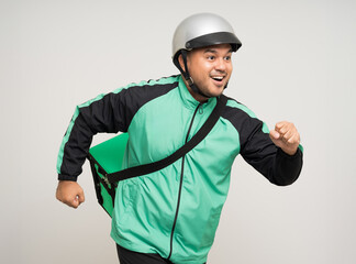 Young asian rider wearing green jacket uniform and helmet various action holding a lot of paper parcel delivery box to customer. Man service worker Courier and shipping food delivery service.