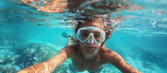 Fototapeta premium Underwater Selfie of a Woman in a Dive Mask