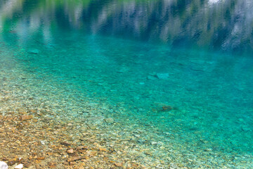 Transparent clean blue water in a mountain lake. Water background. Black Lake below Mount Rysy, Tatra Mountains