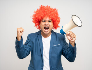 Shout out loud with megaphone. Young Asian man with afro Hairstyle. Funny smiling happiness man...