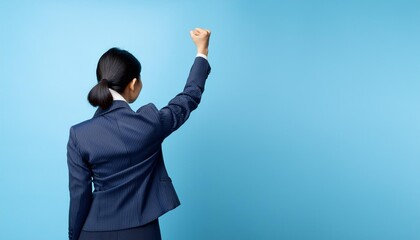 Businessman raising his fist in solidarity.