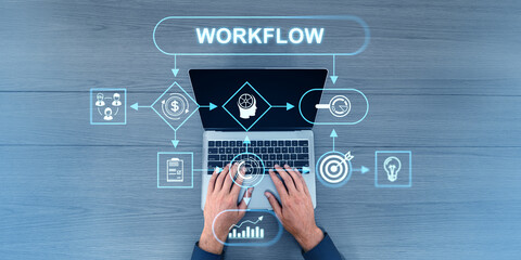Top view of man typing on laptop, flowchart with work process icons and arrows