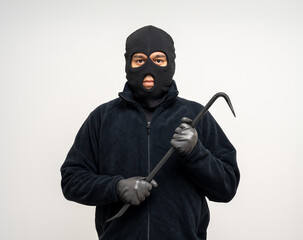 Thief in uniform black jacket various pose on isolated background. The Robber terrorism criminal escapes with balaclava and crowbar entering a house for stealing Housebreak