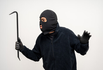 Thief in uniform black jacket various pose on isolated background. The Robber terrorism criminal escapes with balaclava and crowbar entering a house for stealing Housebreak