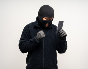 Thief in uniform black jacket various pose on isolated background. The Robber terrorism criminal...