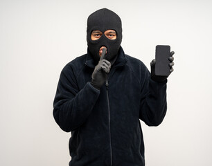 Thief in uniform black jacket various pose on isolated background. The Robber terrorism criminal...