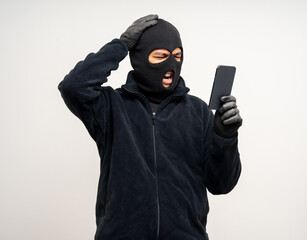 Thief in uniform black jacket various pose on isolated background. The Robber terrorism criminal escapes with balaclava and crowbar entering a house for stealing Housebreak