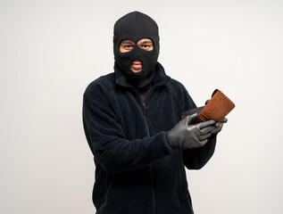 Thief in uniform black jacket various pose on isolated background. The Robber terrorism criminal...