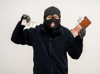 Thief in uniform black jacket various pose on isolated background. The Robber terrorism criminal...