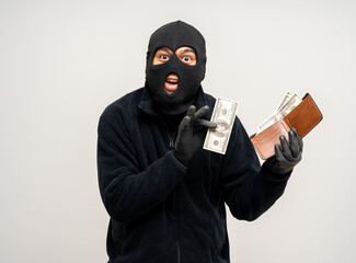 Thief in uniform black jacket various pose on isolated background. The Robber terrorism criminal escapes with balaclava and crowbar entering a house for stealing Housebreak