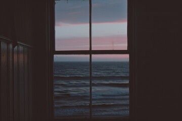 A Window View of the Ocean and Sunset