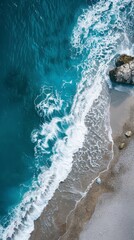 Fototapeta premium Blue ocean waves cascade onto a tranquil beach, inviting relaxation and peace